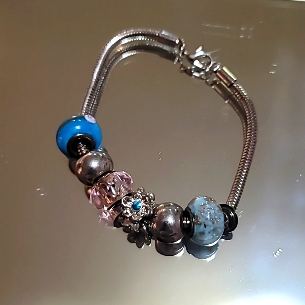 Gently loved 8" Pandora style bracelet with charms mint condition